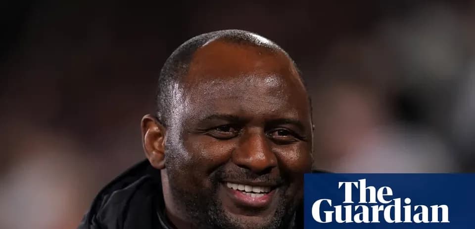 Coach smiling during a match or event