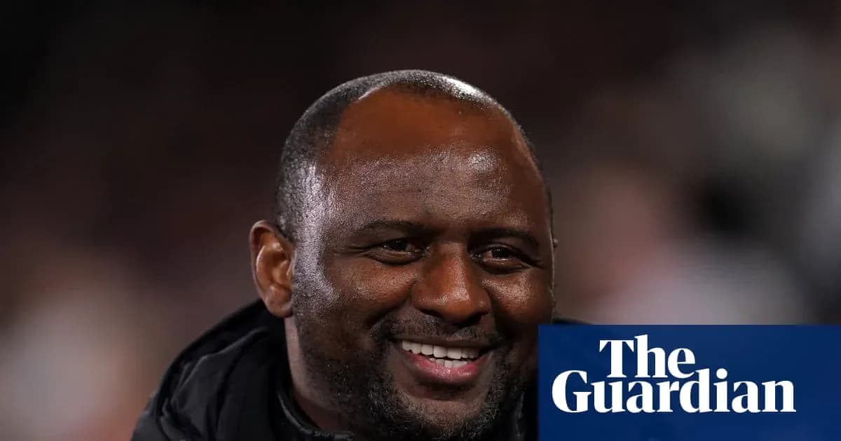 Coach smiling during a match or event