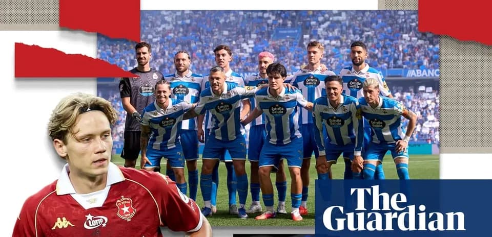 Football team posing for photo on pitch