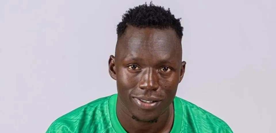 Player in green jersey posing for portrait photo