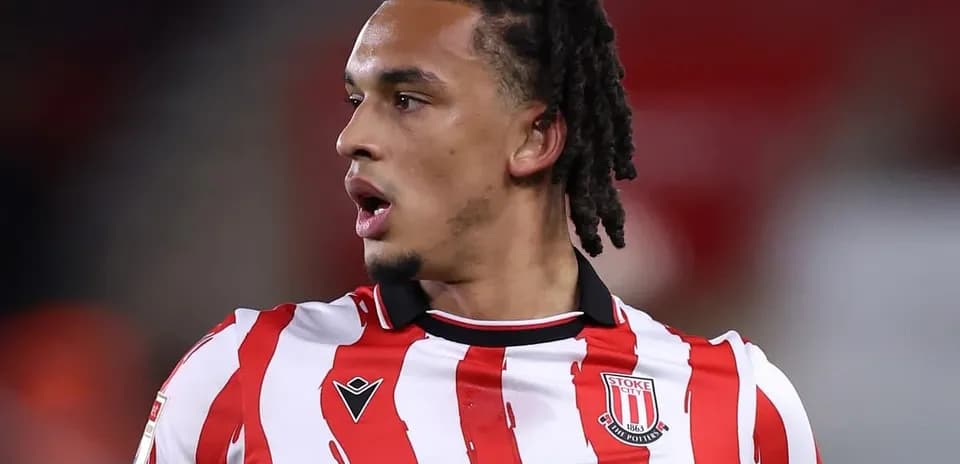 Stoke City player in striped red and white jersey