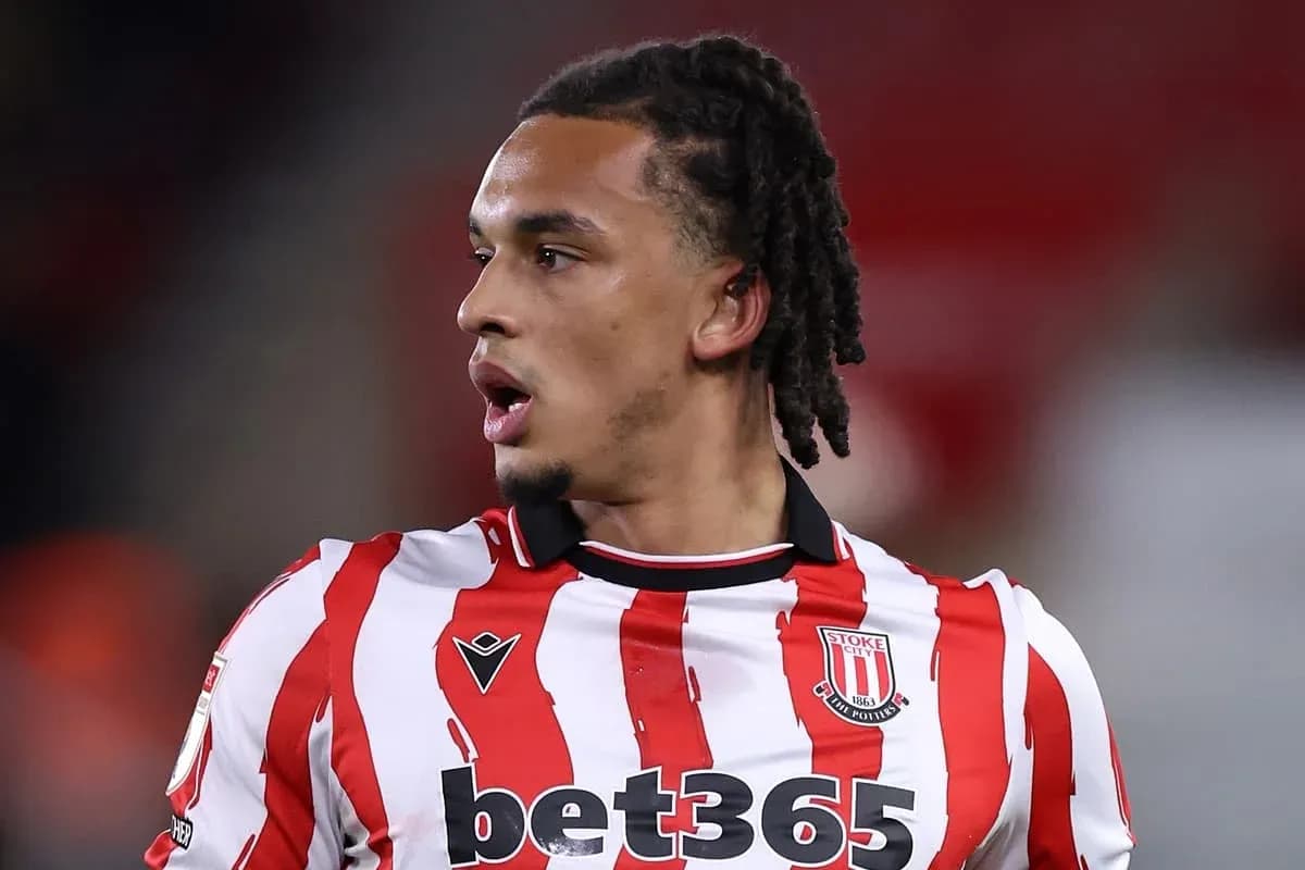 Stoke City player in striped red and white jersey
