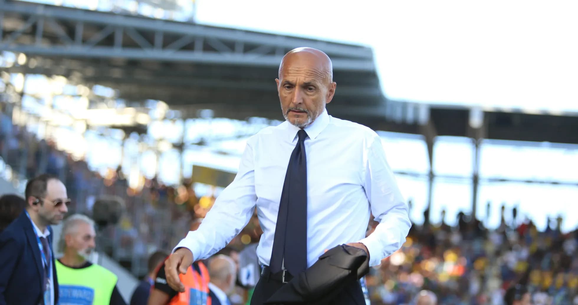 Coach walking on the sidelines during match