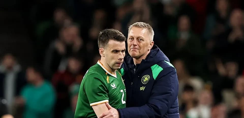 Player and coach interacting on the sidelines
