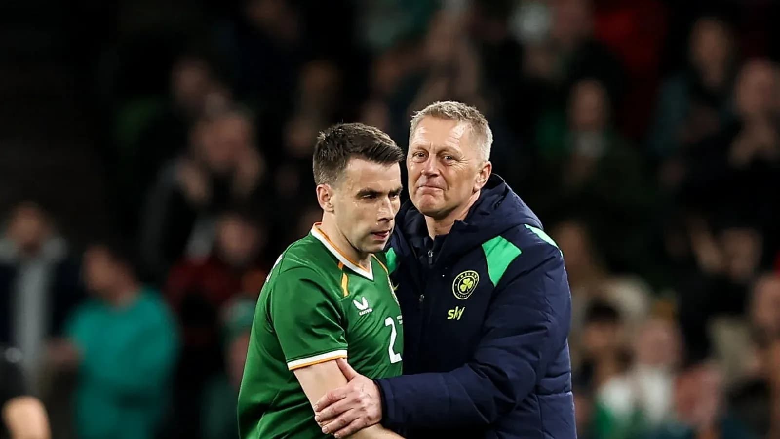 Player and coach interacting on the sidelines