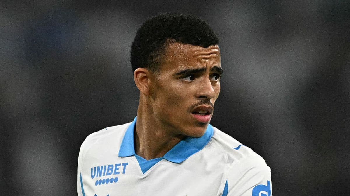 Player wearing a white jersey with blue details