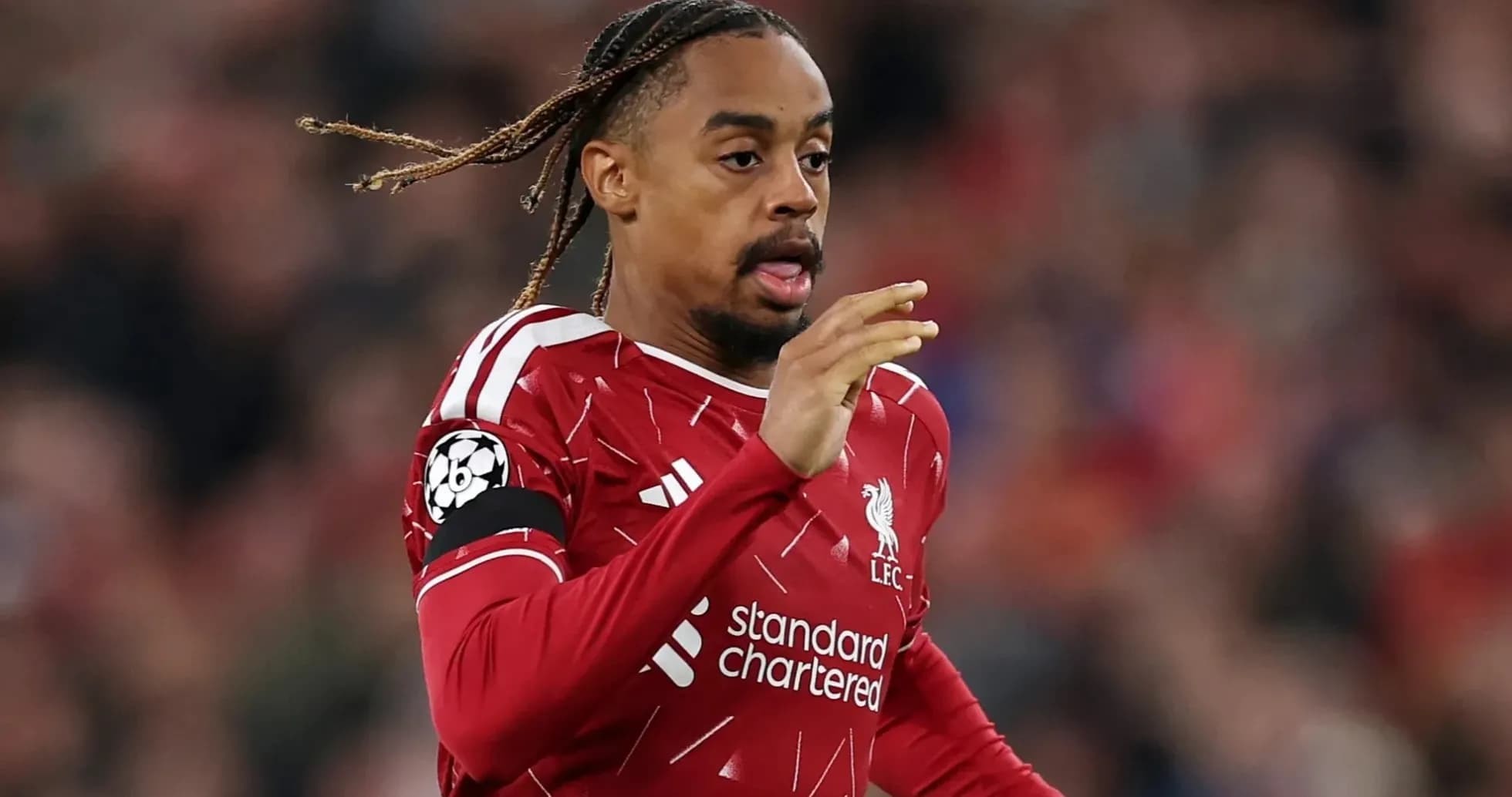 Player running during Liverpool match in red kit
