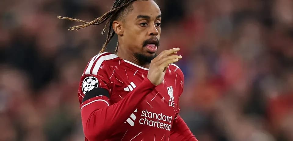 Player running during Liverpool match in red kit