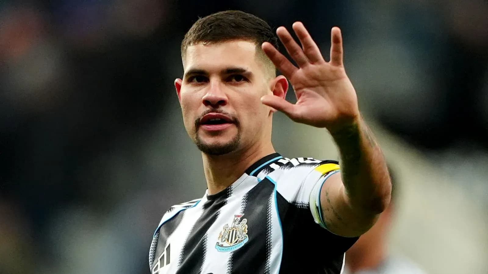Player gesturing during match at stadium