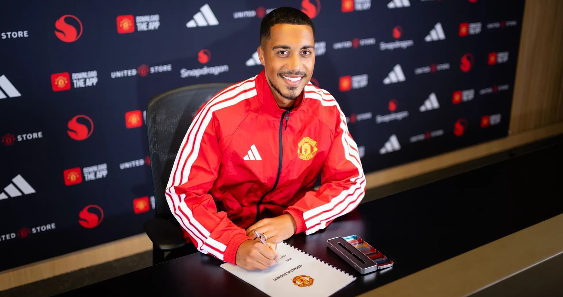 Player signing contract at Manchester United press conference