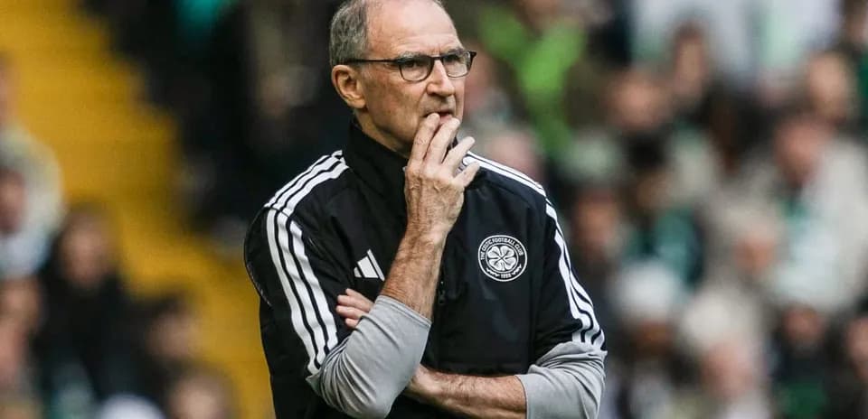 Coach observing match with arms crossed