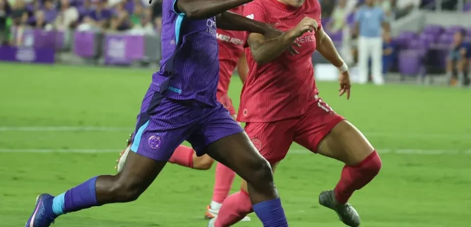 Boston Legacy W player dribbling against Orlando Pride W