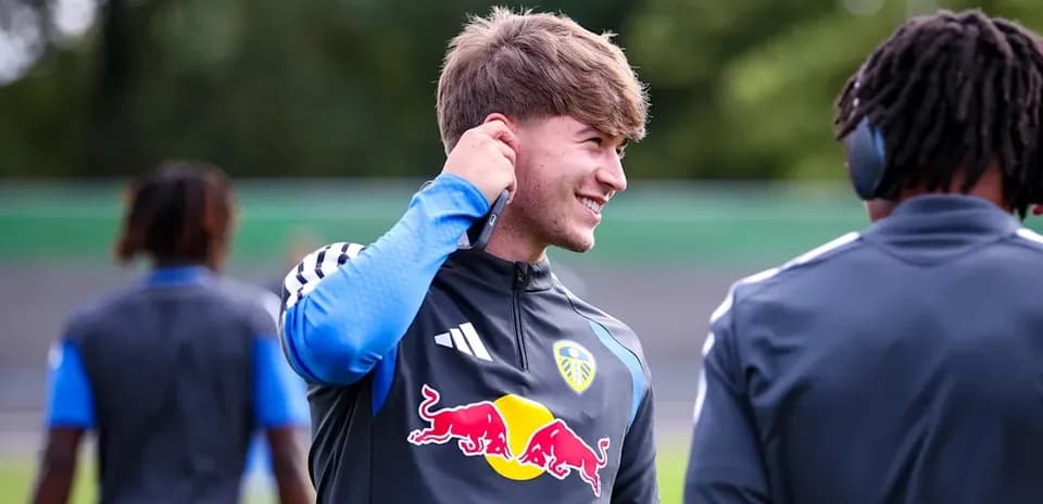 Player adjusting earbud during training session
