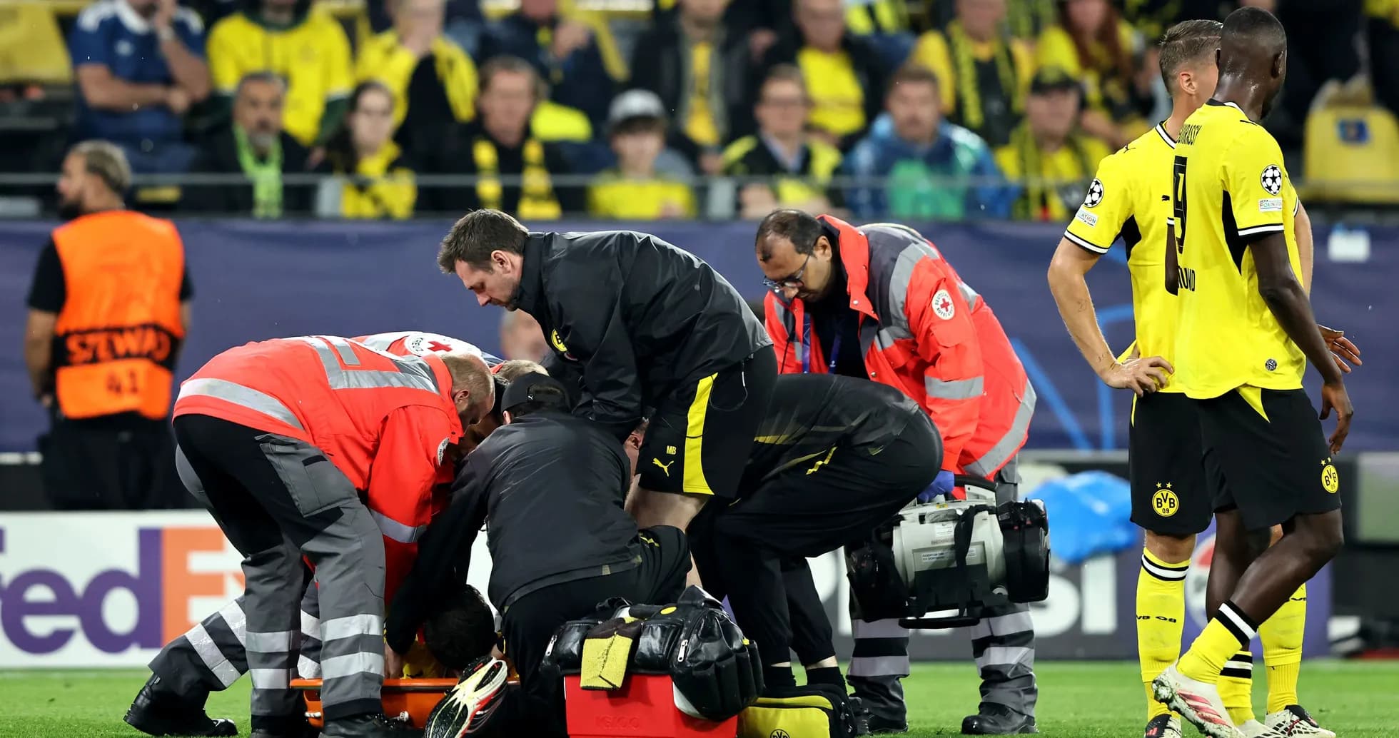Medical team attending to player on the field