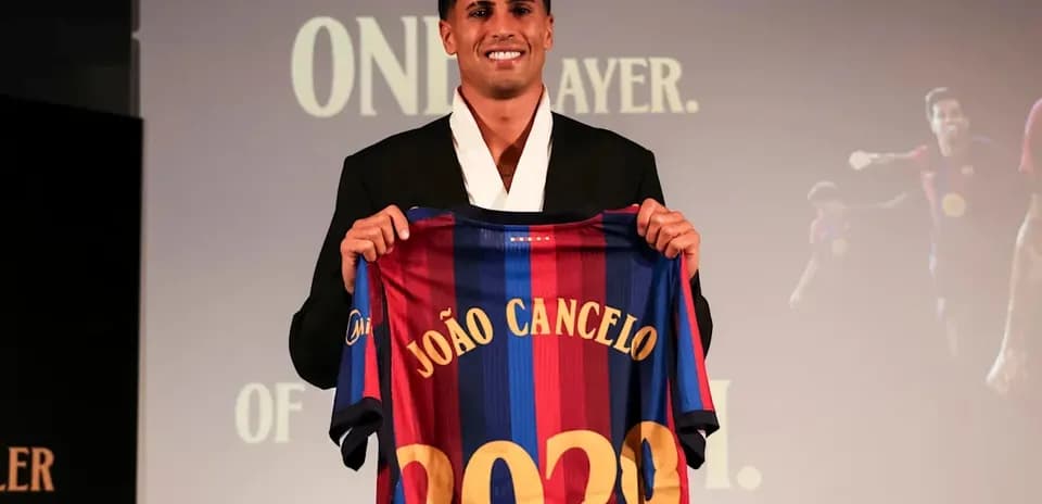Player presenting Barcelona jersey at event