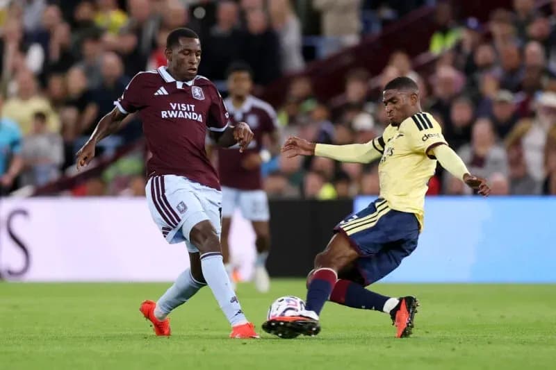 Two players competing for the ball during match