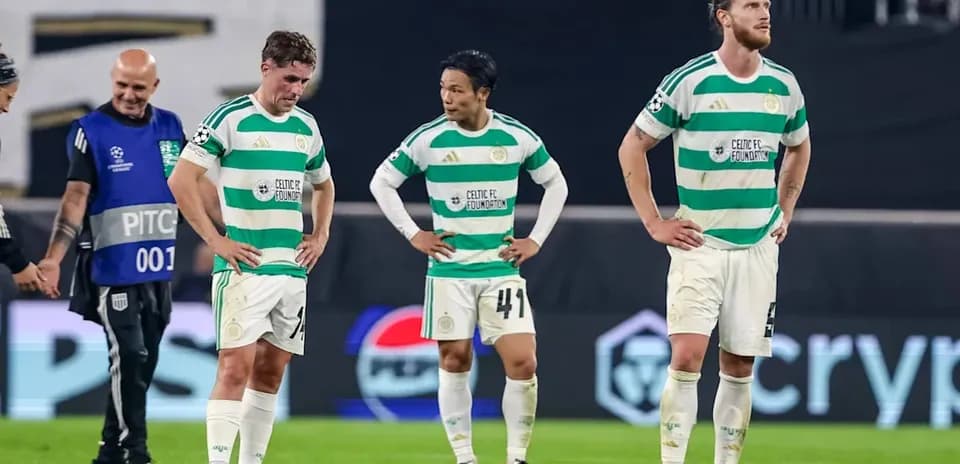 Celtic players walking off field after match