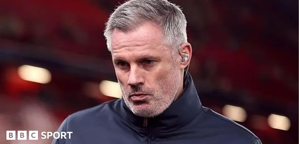 Man with gray hair wearing a navy jacket