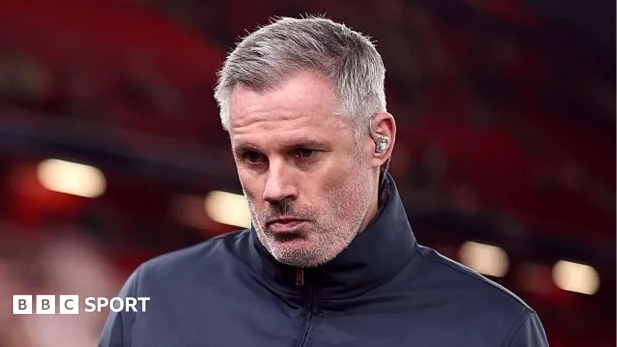 Man with gray hair wearing a navy jacket