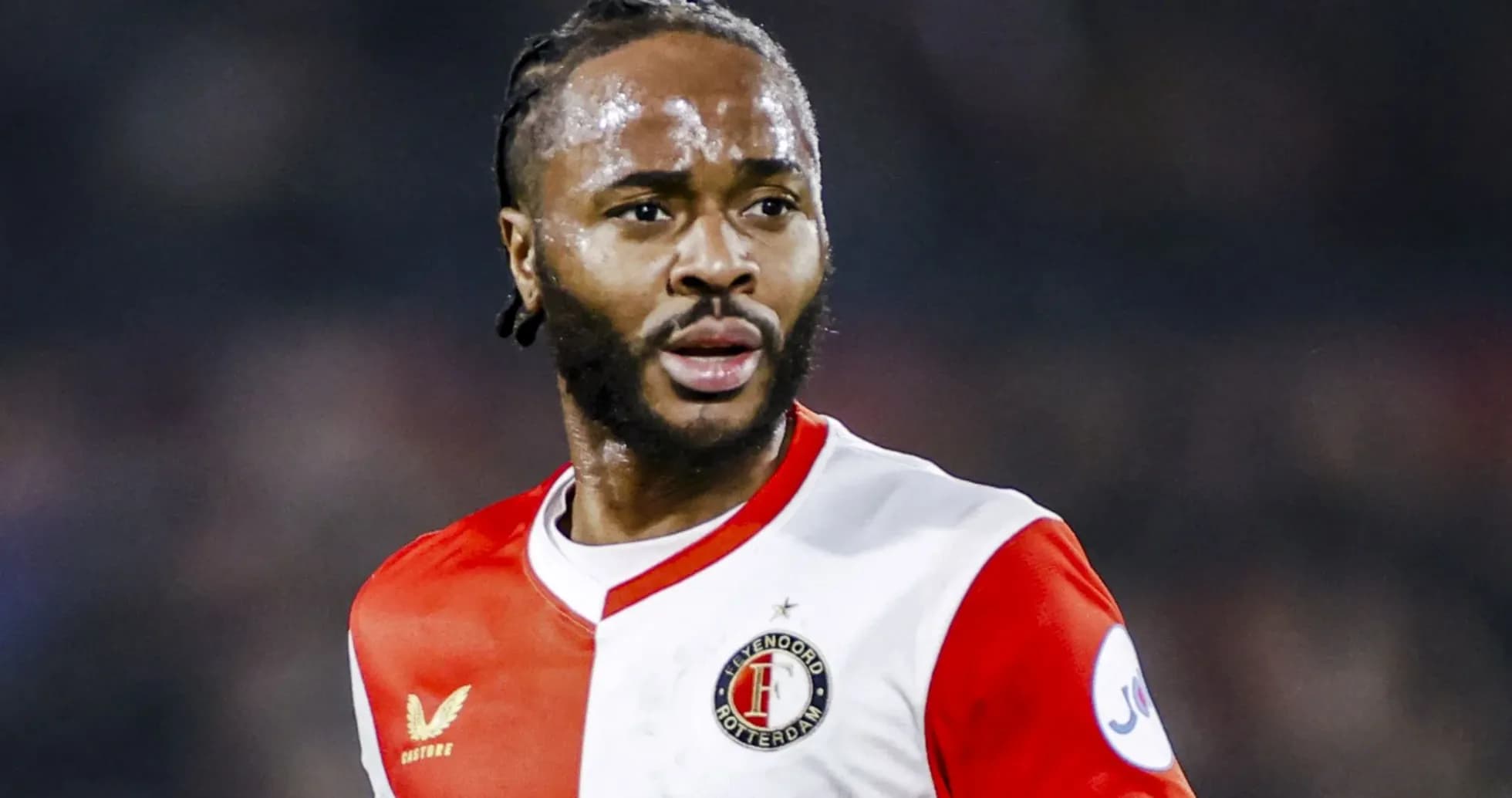 Feyenoord player in red and white jersey during match