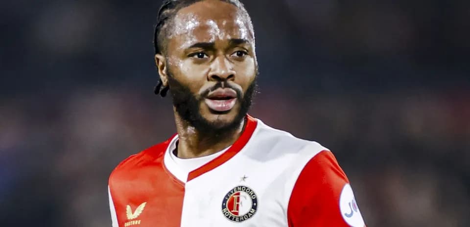 Feyenoord player in red and white jersey during match