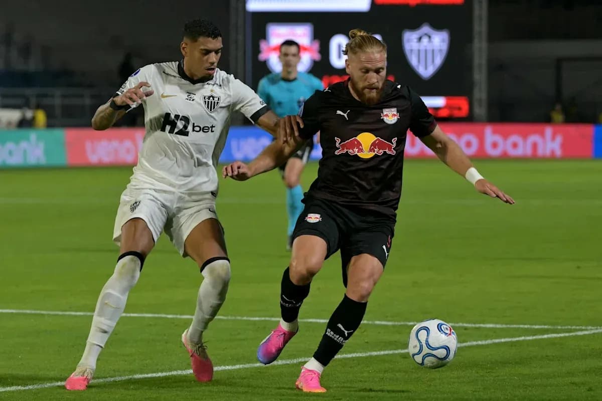Two players competing for the ball during match