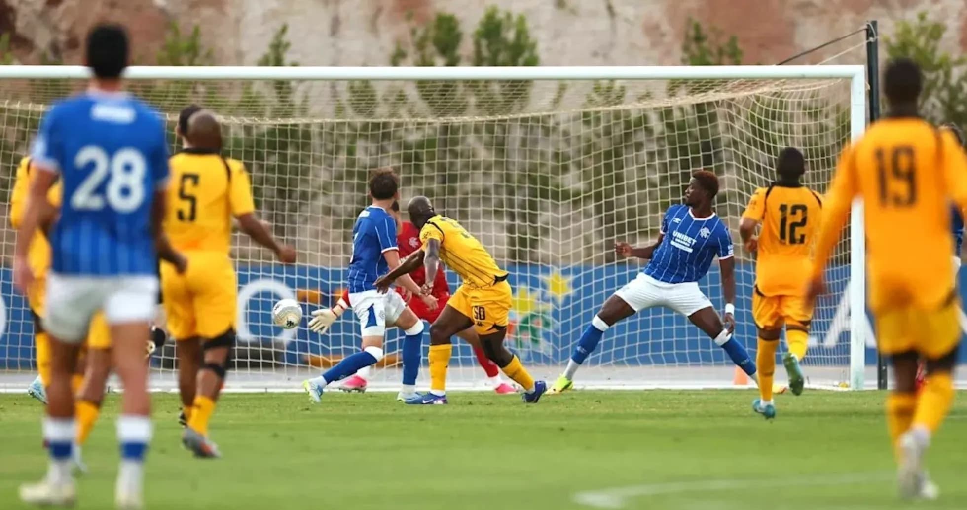 Players in action near the goal during match