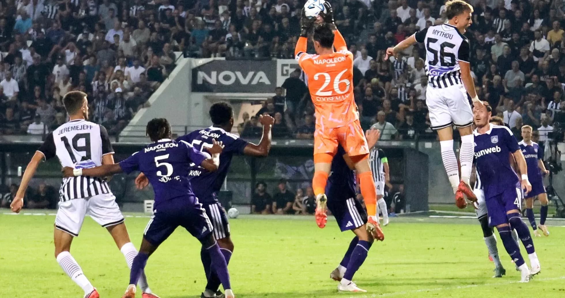 Goalkeeper catching the ball during match action