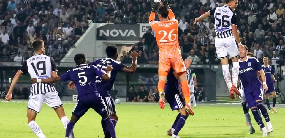 Goalkeeper catching the ball during match action