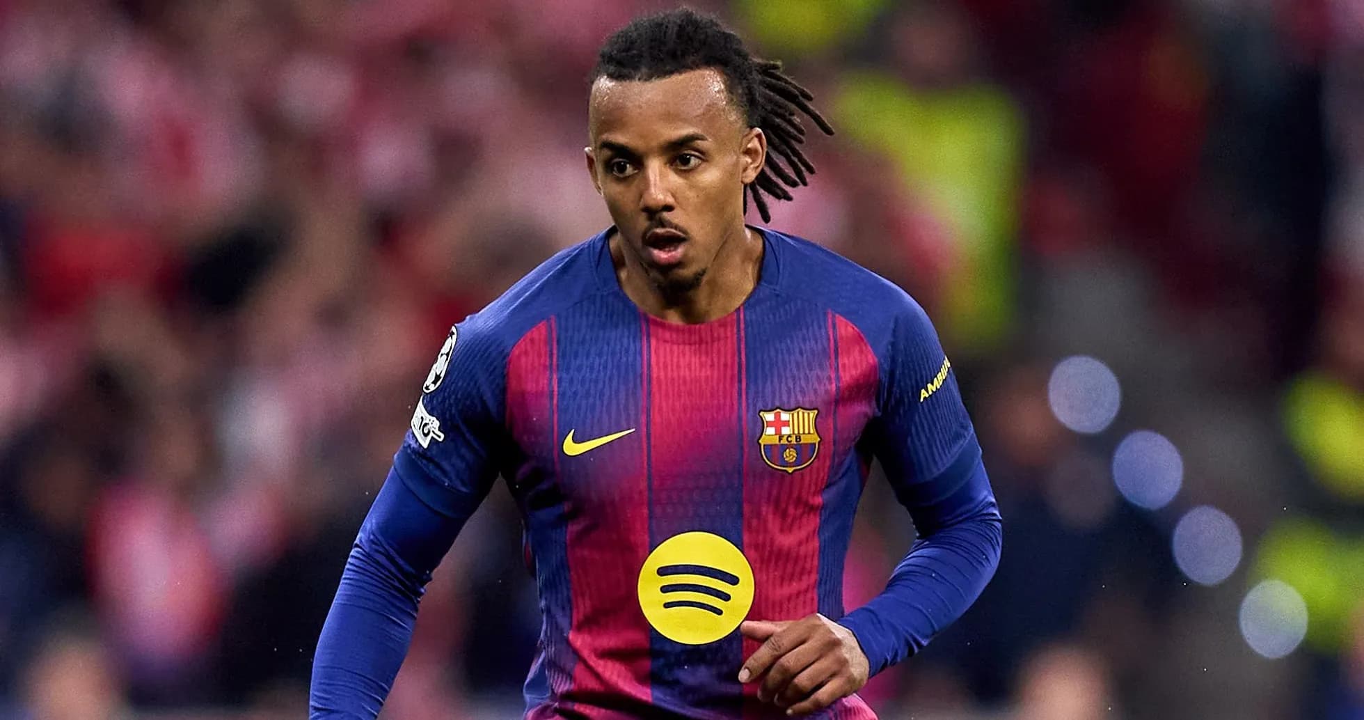 Player in FC Barcelona kit running on the pitch