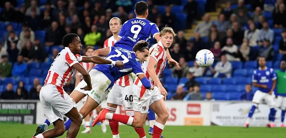 Players contesting a high ball during match action