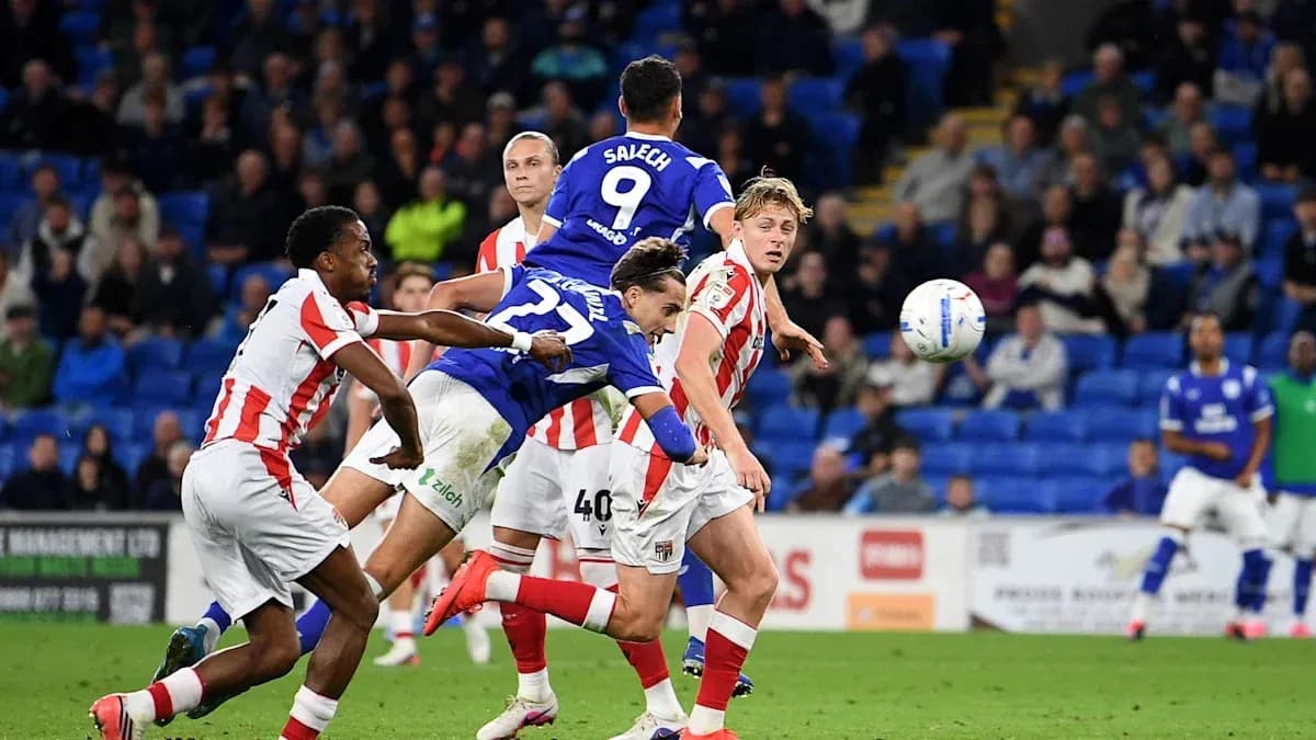 Players contesting a high ball during match action