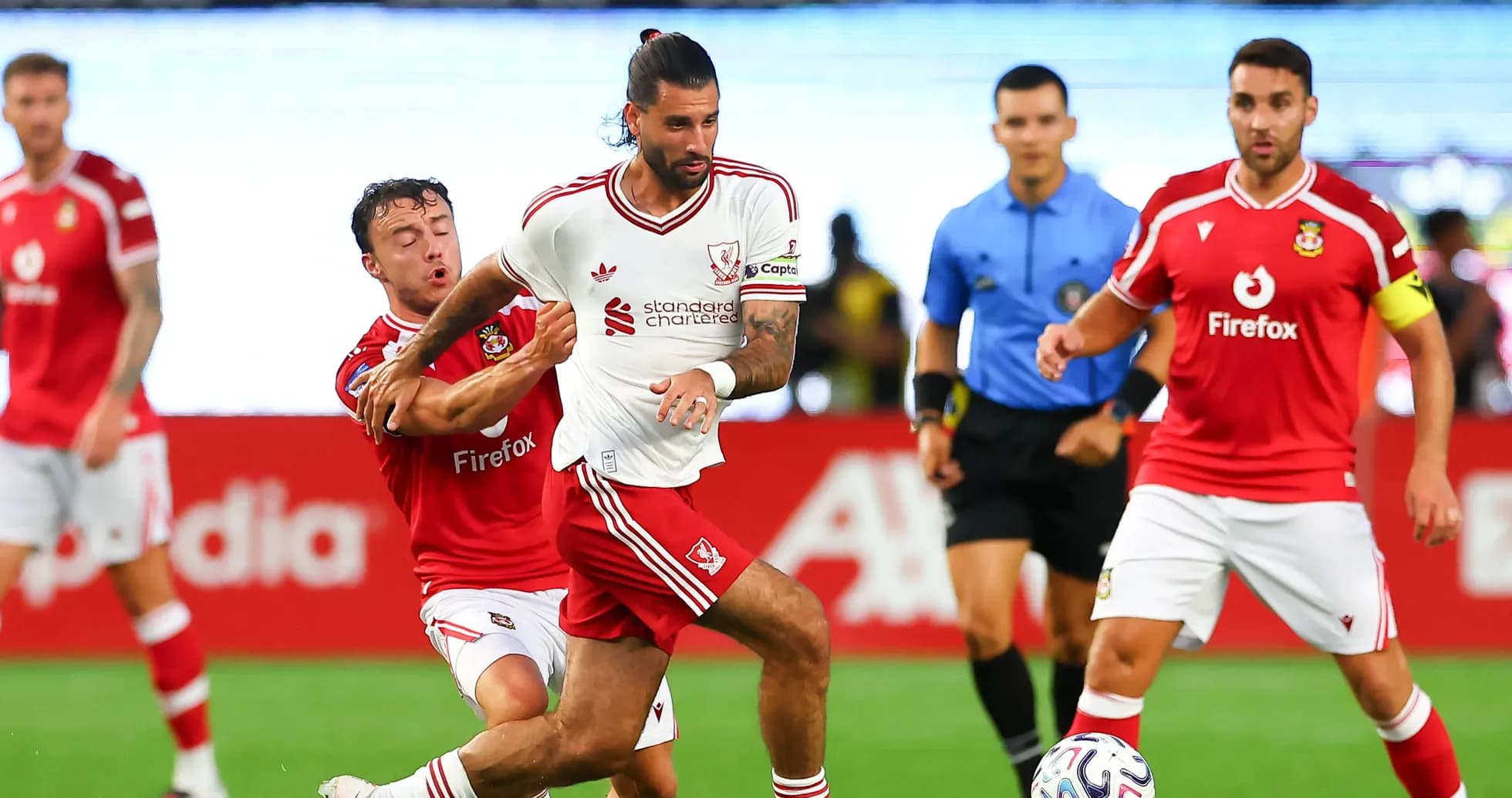 Player dribbling while being challenged by opponent