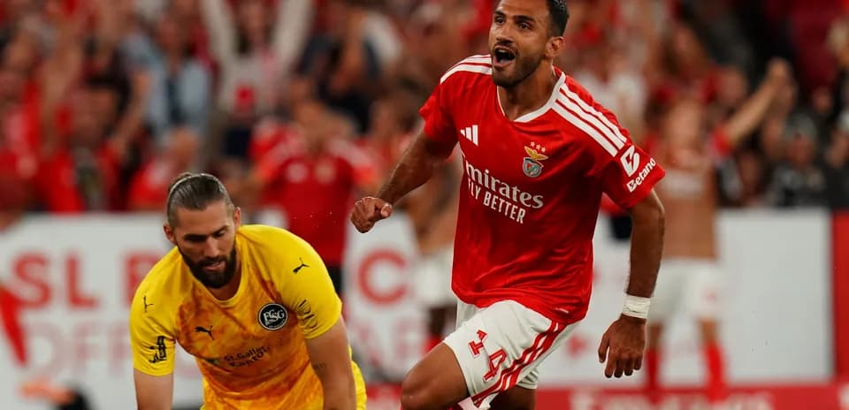 Benfica player celebrating a goal against goalkeeper
