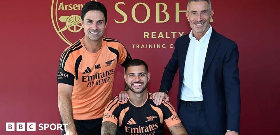 Manager and player pose after signing contract