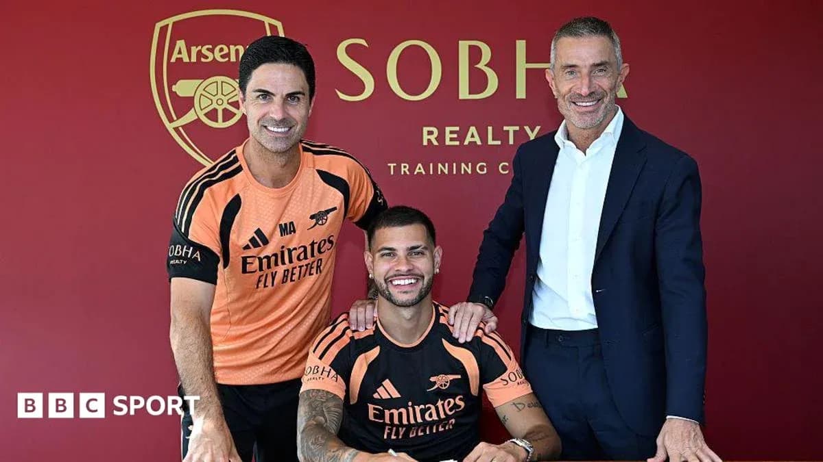Manager and player pose after signing contract