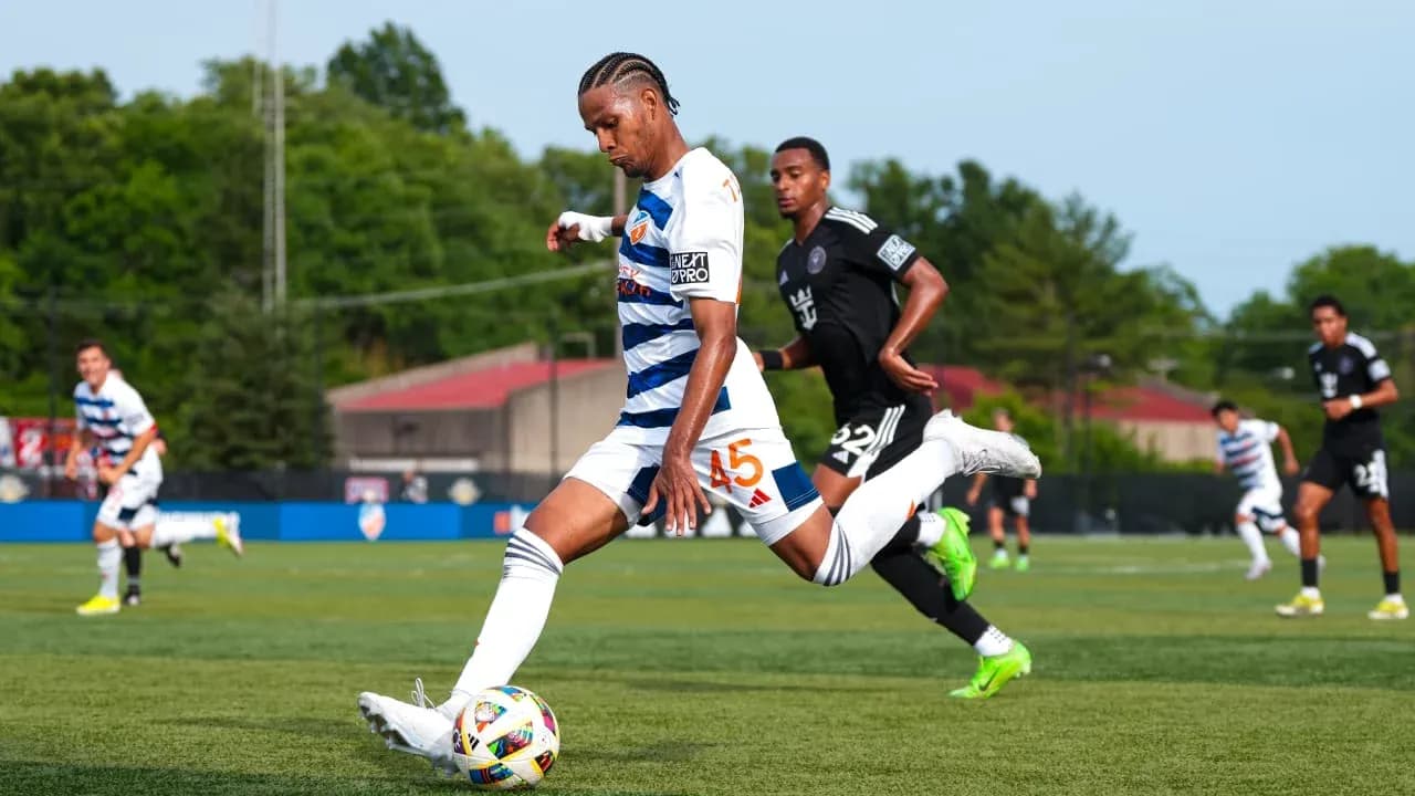 Huntsville City player kicking the ball