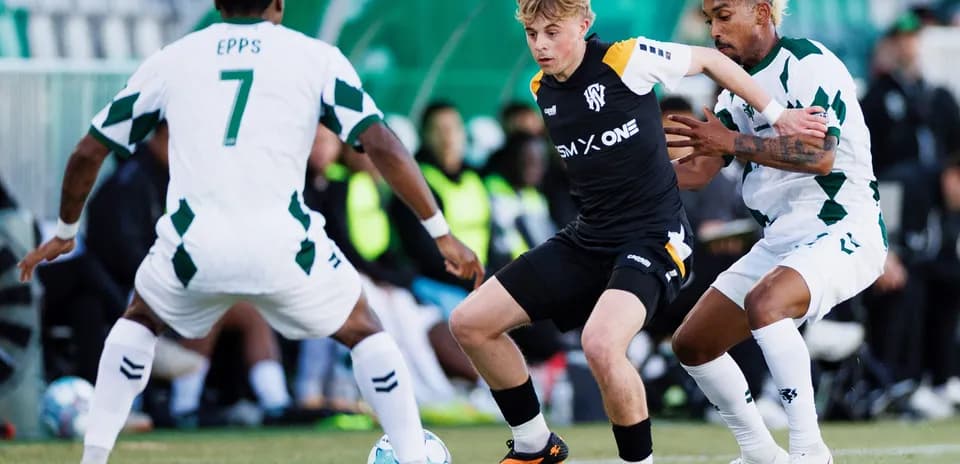 Two players contesting the ball during match