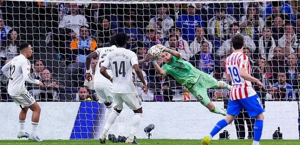 Goalkeeper saving a penalty in Madrid derby