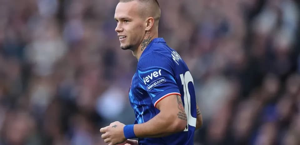 Player in blue jersey during a football match