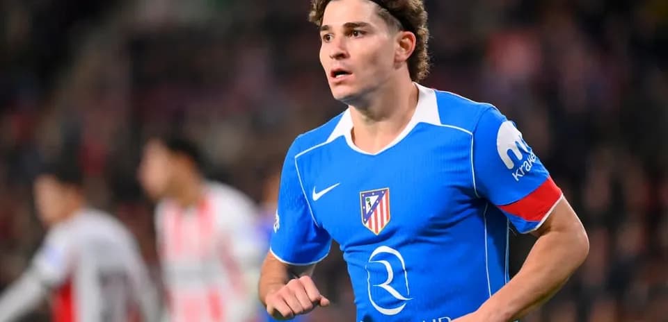 Player in blue Atletico Madrid jersey during match