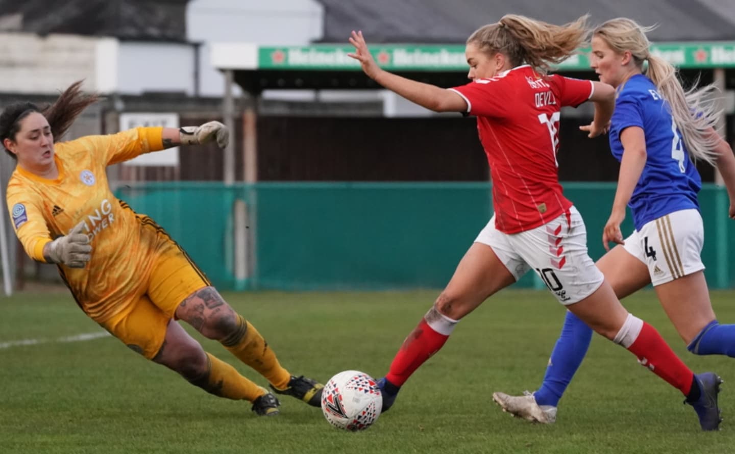 Charlton Athletic W player challenging Leicester City WFC goalkeeper