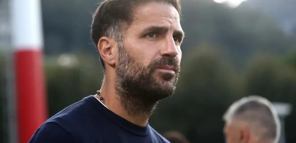 Man with beard observing on training field