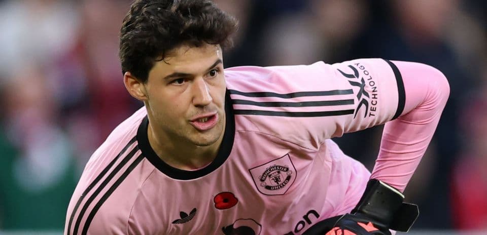 Goalkeeper in pink uniform preparing for play