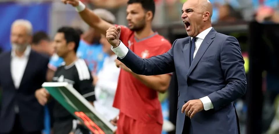 Coach celebrating during a match on the sideline