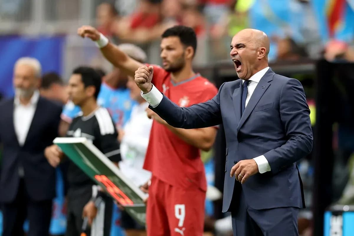 Coach celebrating during a match on the sideline