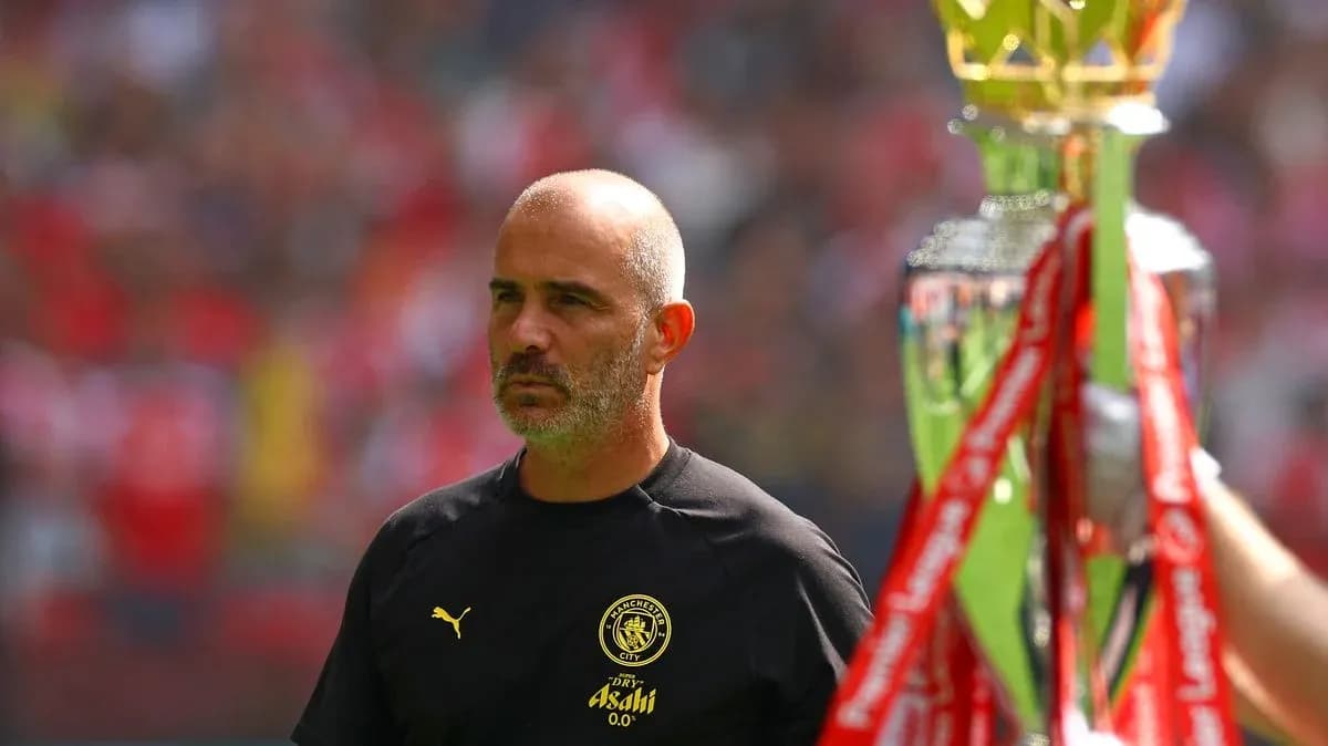 Coach walking past trophy during match ceremony