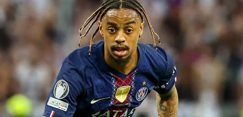 Player in Paris Saint-Germain kit running during match