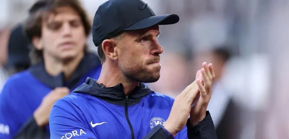 Coach applauding during match on sidelines
