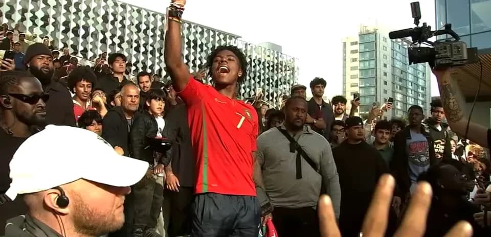 Fan celebrating in Portugal jersey at event